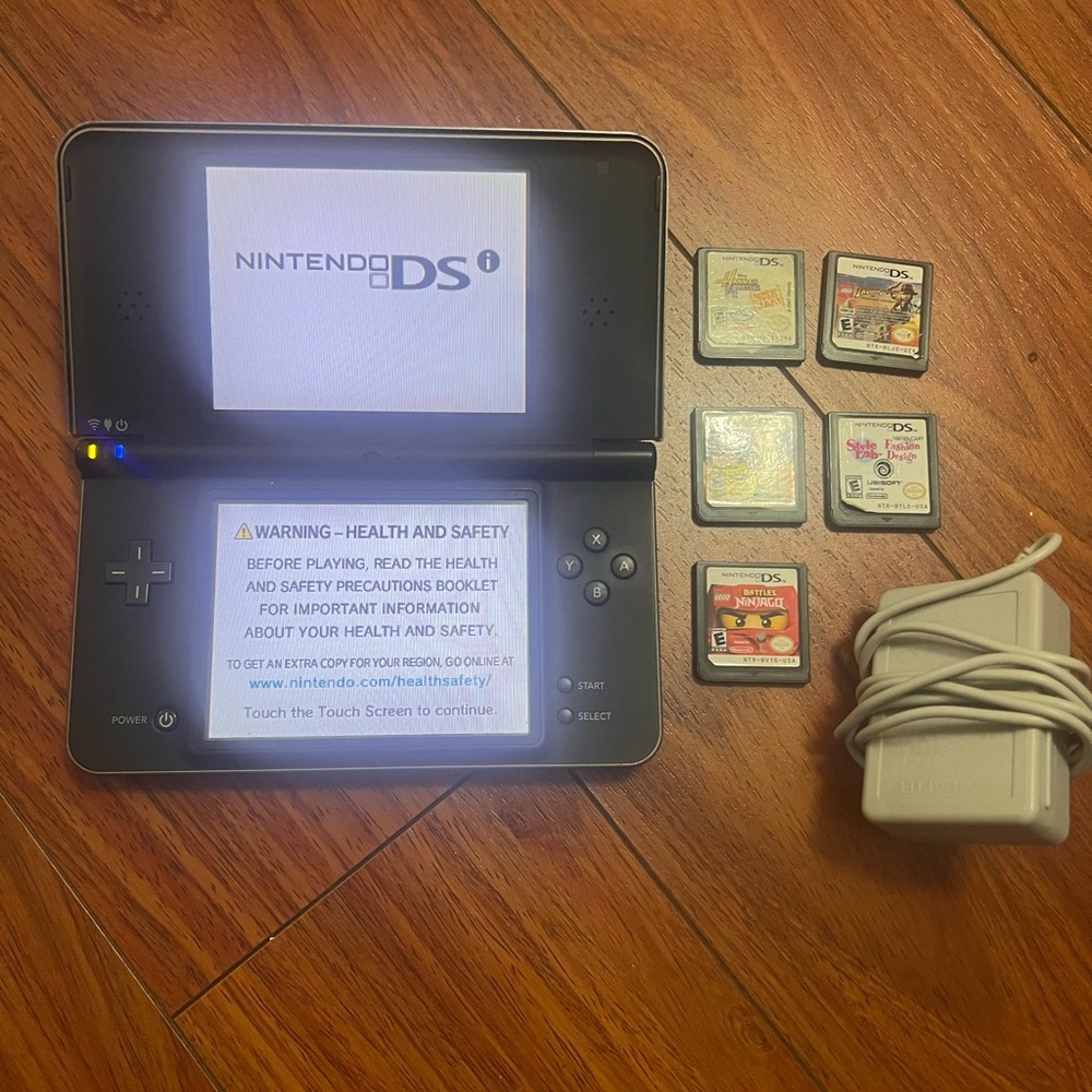 Nintendo DSI XL with games and charger